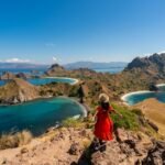 young-female-tourist-enjoying-the-beautiful-landscape-at-padar-island-in-komodo-national-park.jpg